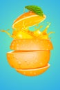 a sliced orange with a splash of juice Royalty Free Stock Photo