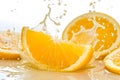 Sliced of Orange with splashing juice on white background Royalty Free Stock Photo