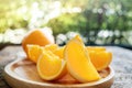 Sliced Orange on Wooden Plate. Fresh Juicy Fruit in Summer. Selective Focus