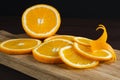 Sliced oranges fruit and peel on wooden board. Orange juicy fruit, citrus minimal concept Royalty Free Stock Photo