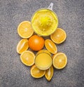 Sliced oranges and juicer granit rustic background top view close up Royalty Free Stock Photo