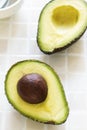 Sliced organic avocado on the kitchen table