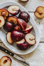 Sliced organic plums in a bowl