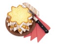 Sliced pandoro, Italian sweet yeast bread, traditional Christmas treat. With red serviettes and knife on white. Overhead Royalty Free Stock Photo