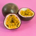 Sliced passion fruit. Fresh passion fruit on a pink background. Royalty Free Stock Photo