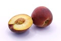 Sliced peach, whole peach close-up Royalty Free Stock Photo