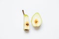 Sliced pear with a worm on a white background