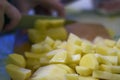 Sliced, peeled raw potatoes on a board. potato preparation process Royalty Free Stock Photo