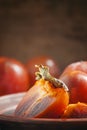 Sliced persimmon on a plate, selective focus