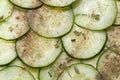 Sliced pickle with herbs and pepper