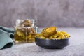Sliced pickled jalapeno peppers in bowl and glass jar on table Royalty Free Stock Photo
