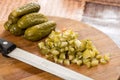 Sliced pickles on the kitchen wooden board Royalty Free Stock Photo