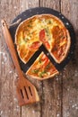 Sliced pie with cream cheese, tomatoes and herbs closeup. Vertical top view Royalty Free Stock Photo