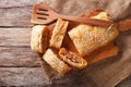 sliced pie stuffed with cabbage and sausages close-up. horizontal top view Royalty Free Stock Photo