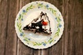 A sliced piece of a black forest cake, a light chocolate sponge cake, soaked with cherry syrup and cherry brandy Royalty Free Stock Photo