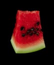 Sliced piece of ripe watermelon on black background isolated Royalty Free Stock Photo