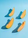 Sliced pieces of melon on blue background Royalty Free Stock Photo