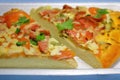 Sliced pieces of pizza in plastic packaging on the table. Royalty Free Stock Photo