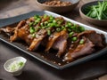 Sliced Pig Trotters with thick oyster sauce and spring onions on top Royalty Free Stock Photo