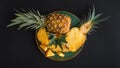 Sliced Pineapple. Bromelain whole pineapple tropical summer fruit halves pineapple black dark background on green plate