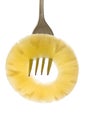 Sliced pineapple on a fork Royalty Free Stock Photo