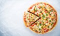 Sliced pizza with mozzarella cheese, chicken, sweet corn, sweet pepper and parsley on white background top view Royalty Free Stock Photo