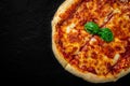 Sliced Pizza with Mozzarella cheese, Tomatoes, pepper, Spices. Italian pizza. Pizza Margherita Royalty Free Stock Photo