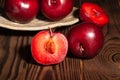 Sliced plum on wood Royalty Free Stock Photo