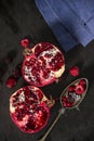 Sliced pomegranate and forest fruits with antique silver spoon. Royalty Free Stock Photo