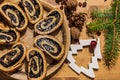 Sliced poppy seed roll and christmas ornaments Royalty Free Stock Photo