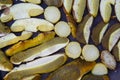 Sliced porcini mushrooms before drying. Sliced dried natural porcini mushrooms on a wood background. Royalty Free Stock Photo