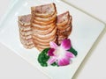 Sliced pork marinated products, square white porcelain dishes and Chinese dishes decorated with flowers. Royalty Free Stock Photo