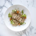 Sliced Pork Tenderloin and Wholegrain Salad on a Marble Background Royalty Free Stock Photo