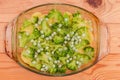 Sliced potato and broccoli, green peas for casserole in bowl Royalty Free Stock Photo