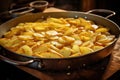 sliced potatoes ready for frying in hot oil