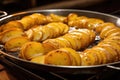 sliced potatoes ready for frying in hot oil