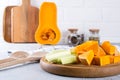 Sliced pumpkin on a wooden board. Home cooking food with pumpkin. Royalty Free Stock Photo