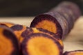 Sliced purple-orange carrots on the table Royalty Free Stock Photo