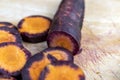 Sliced purple-orange carrots on the table Royalty Free Stock Photo