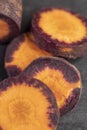 Sliced purple-orange carrots on the table Royalty Free Stock Photo