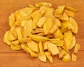 Sliced quince on a wooden background. in the process of cooking quince jam