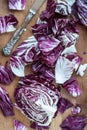 Sliced radicchio on wooden table. Selective focus. Vertical Royalty Free Stock Photo