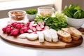 sliced radishes and bread platter for preparing bruschetta