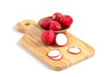 Sliced Radishes on cutting board on white background