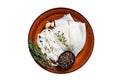 Sliced raw rings squid in a rustic plate with rosemary. High quality Isolate, white background. Royalty Free Stock Photo