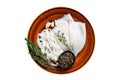 Sliced raw rings squid in a rustic plate with rosemary. Isolated on white background. Royalty Free Stock Photo