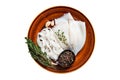 Sliced raw rings squid in a rustic plate with rosemary. Isolated on white background. Royalty Free Stock Photo
