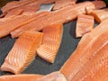 Sliced raw salmon or fresh salmon. Salmon fillets for sale at market displayed with a patchwork effect. Many fresh salmon fish Royalty Free Stock Photo