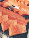 Sliced raw salmon or fresh salmon. Salmon fillets for sale at market displayed with a patchwork effect. Many fresh salmon fish Royalty Free Stock Photo