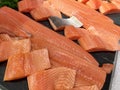 Sliced raw salmon or fresh salmon. Salmon fillets for sale at market displayed with a patchwork effect. Many fresh salmon fish Royalty Free Stock Photo